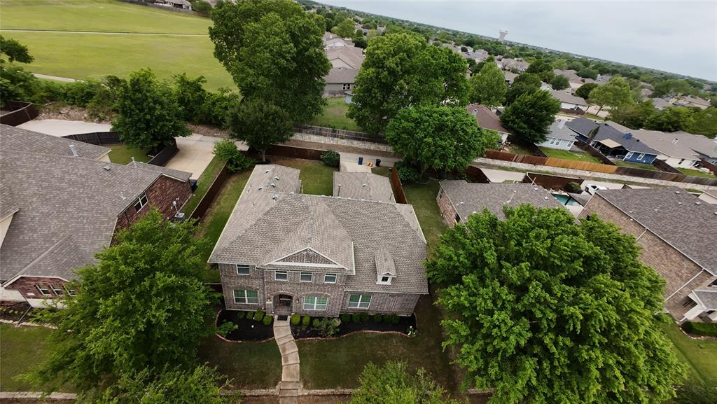 12809 Spring Hill Drive Frisco, TX 75035 - Photo 3 of 37 an aerial view of a house with a garden
