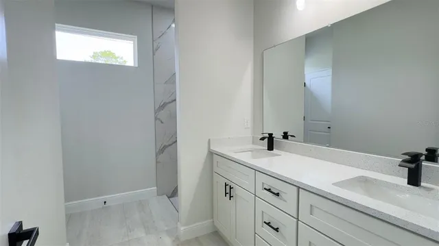 a bathroom with a sink and a mirror