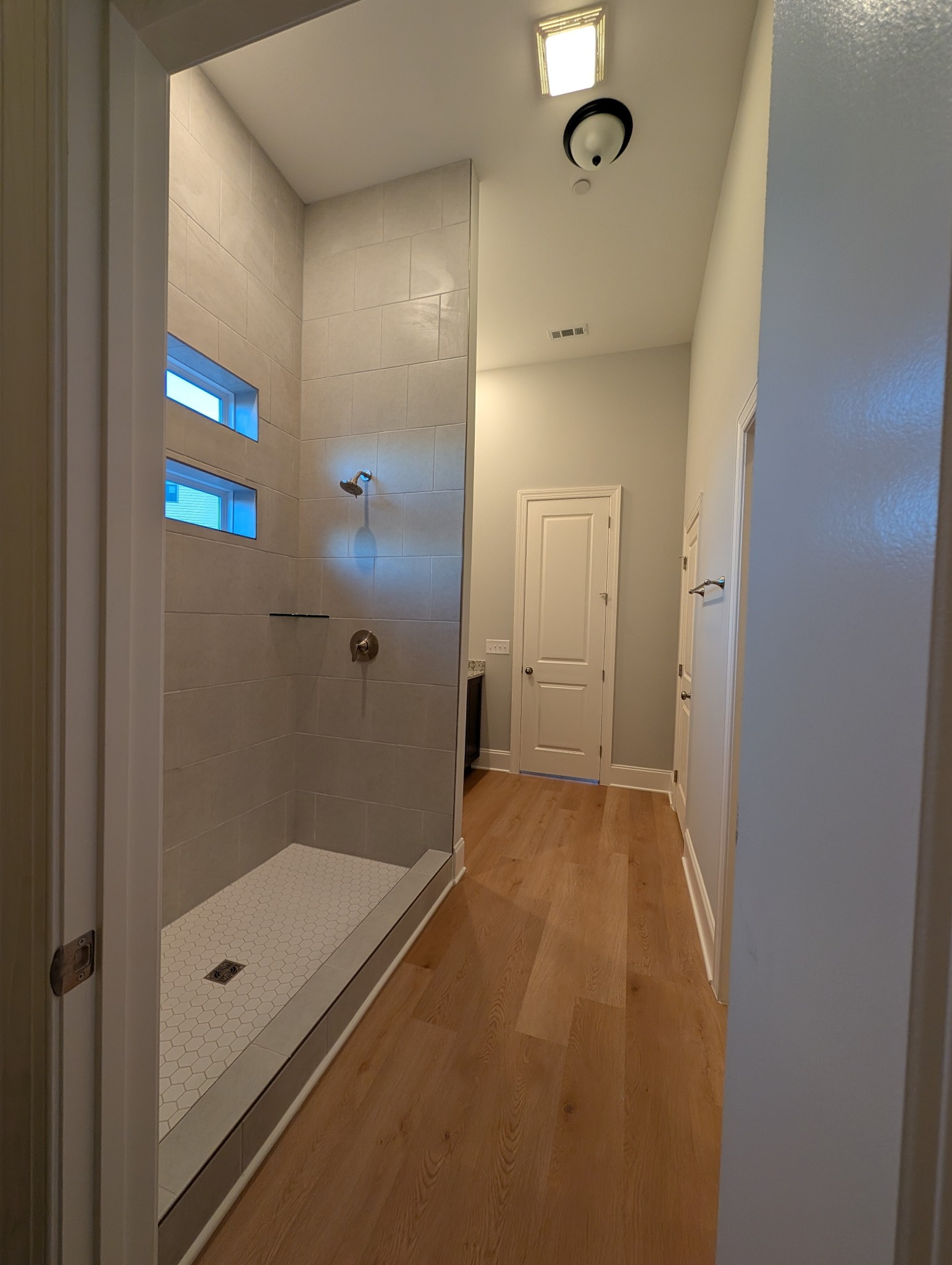 6135 Beckwith Road Mount Juliet, TN 37122 - Photo 18 of 33 a bathroom with a granite countertop sink a mirror and a shower