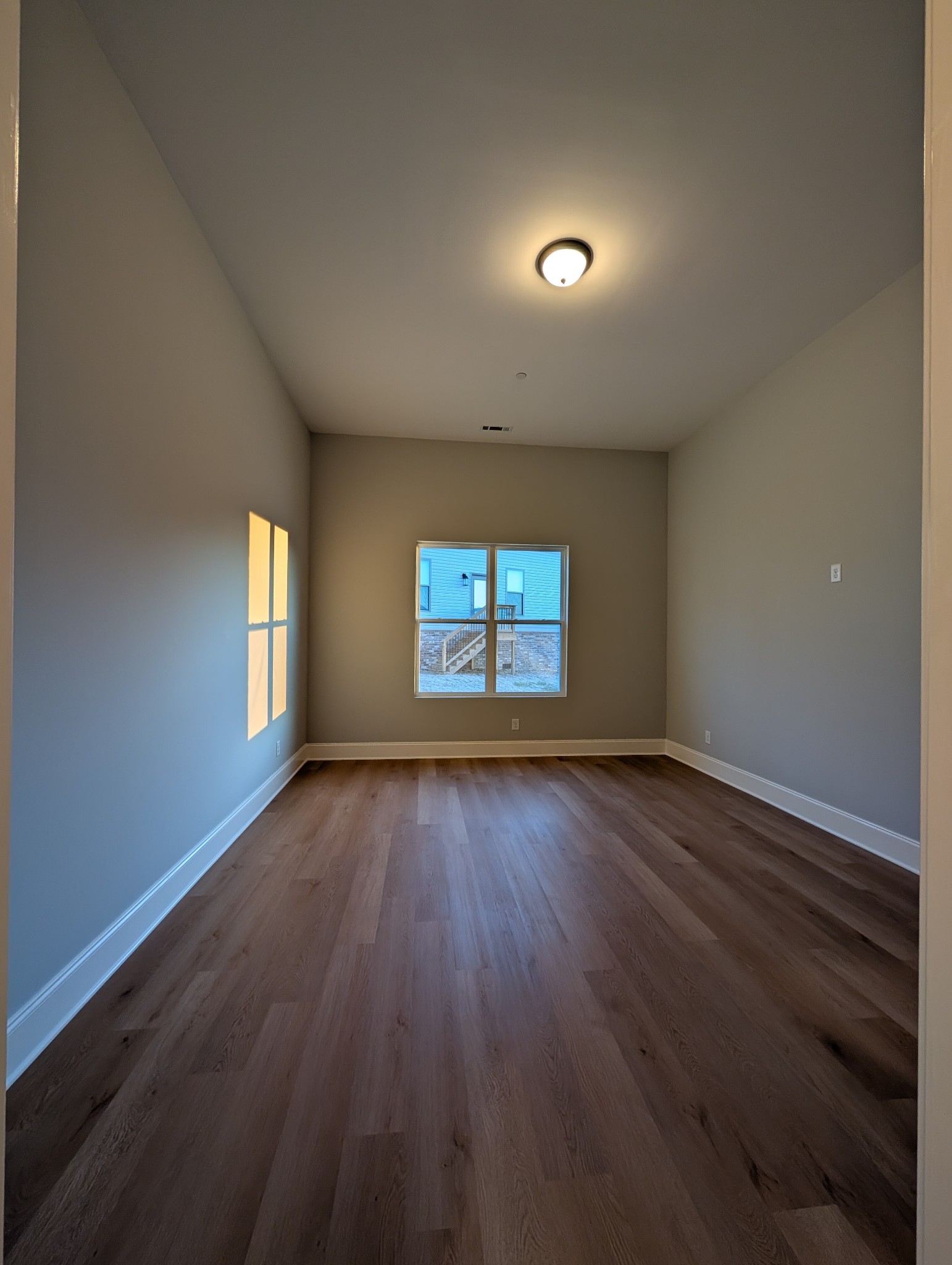 6135 Beckwith Road Mount Juliet, TN 37122 - Photo 20 of 33 an empty room with wooden floor and windows
