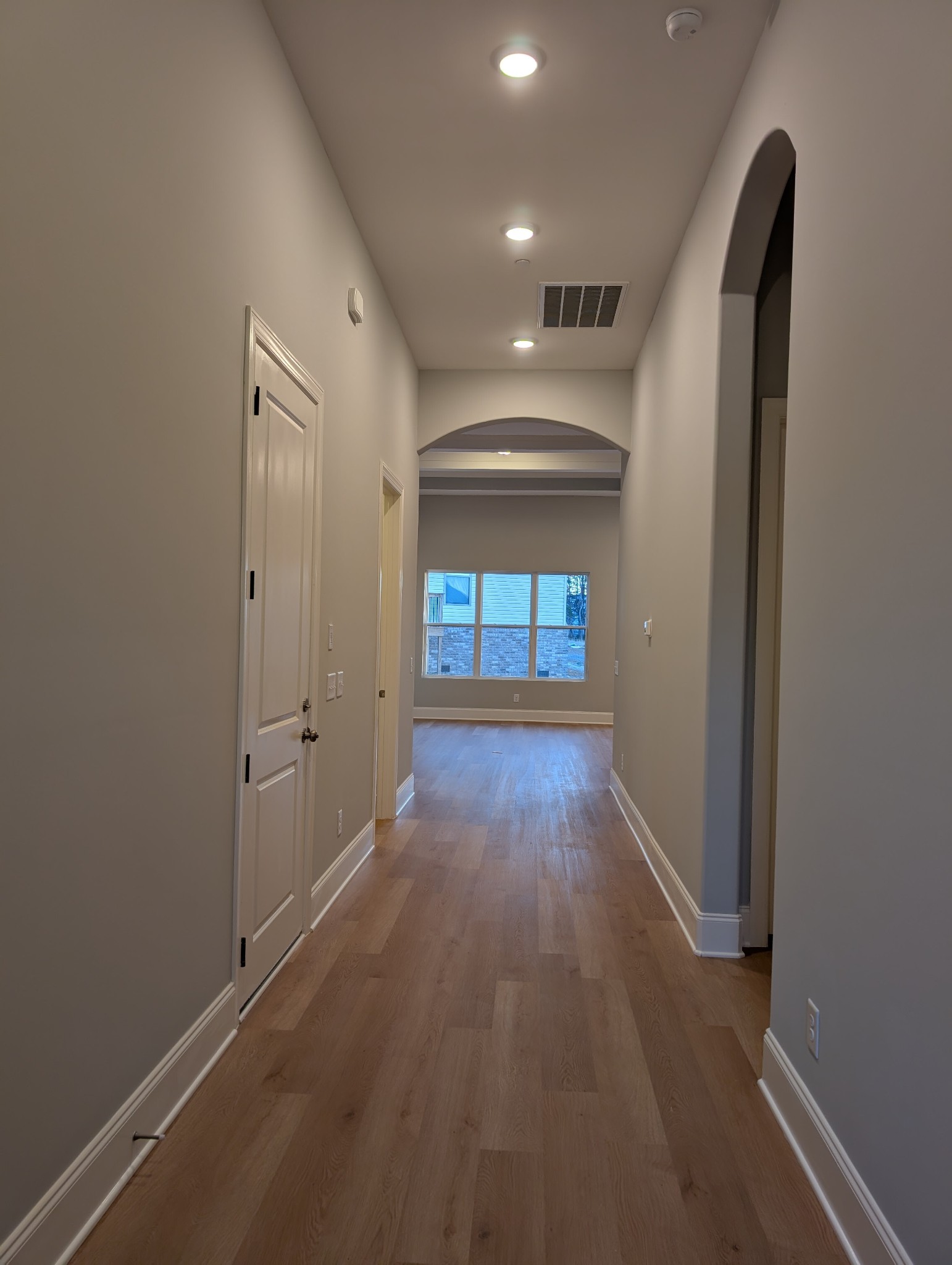 6135 Beckwith Road Mount Juliet, TN 37122 - Photo 9 of 33 an empty room with wooden floor and windows