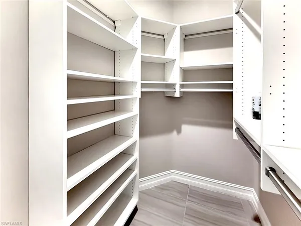 a view of house with garden space and lake view