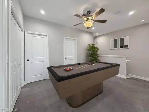 a kitchen with granite countertop white cabinets and stainless steel appliances