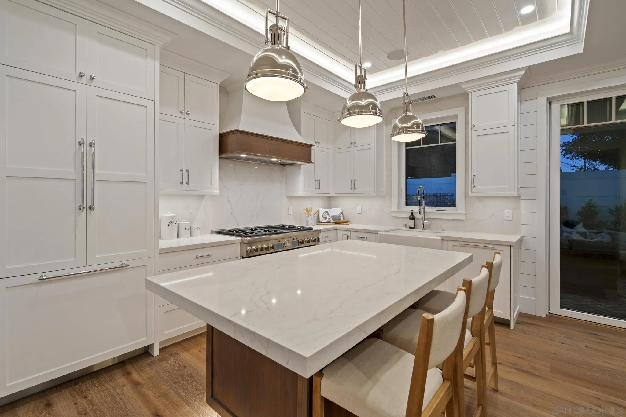 462 Westbourne Street La Jolla, CA 92037 - Photo 27 of 75 a kitchen with a stove a sink and a refrigerator