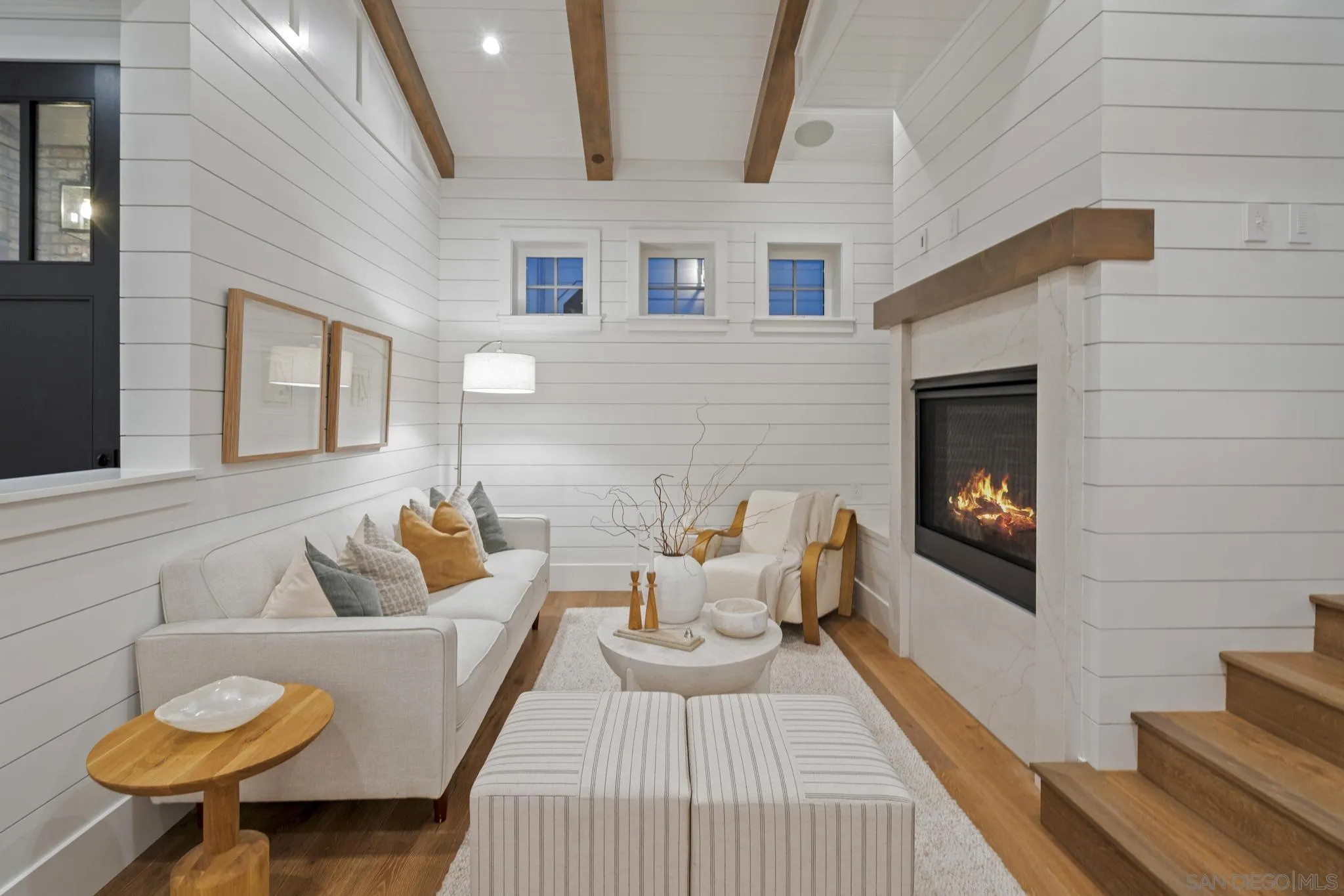 462 Westbourne Street La Jolla, CA 92037 - Photo 28 of 75 a living room with furniture and a fireplace