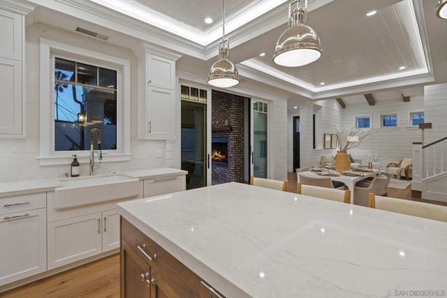 a bathroom with a shower sink and mirror
