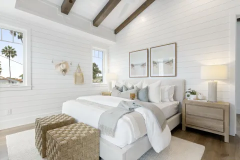 a bedroom with a bed and a couch