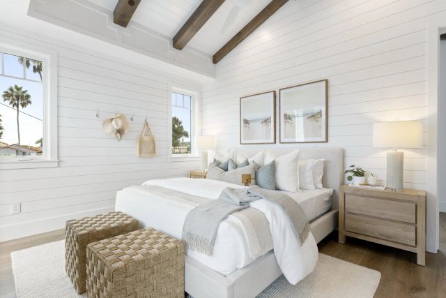 a bedroom with a bed and a couch