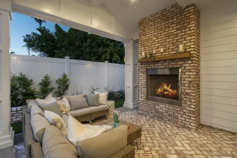 a spacious bathroom with a granite countertop sink a toilet a mirror and shower