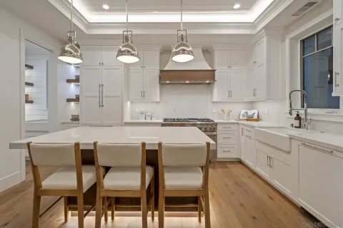 a bathroom with a double vanity sink a mirror and a bathtub