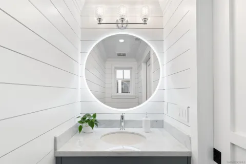 a bedroom with a large bed and a dresser