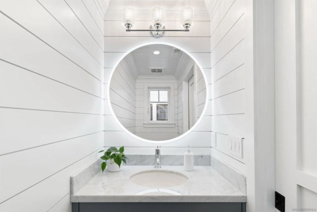 a bedroom with a large bed and a dresser