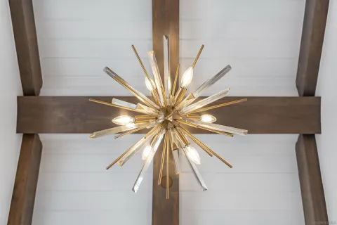 a living room with furniture and large windows