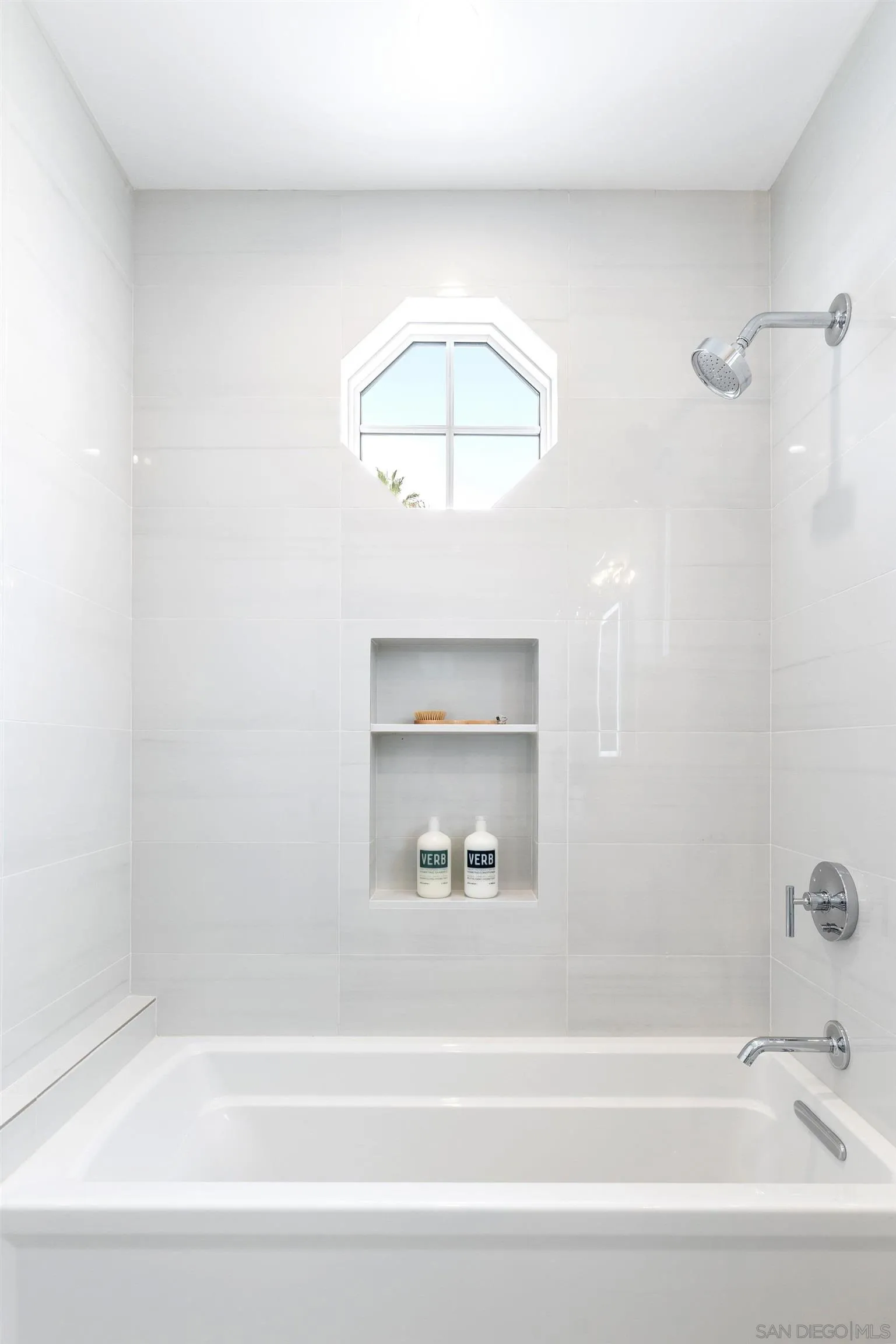 462 Westbourne Street La Jolla, CA 92037 - Photo 54 of 75 a bathroom with a bathtub and a shower