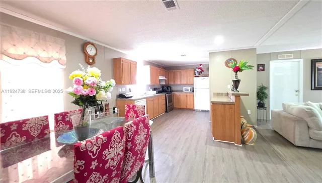 a living room with furniture and flowers