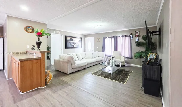a living room with furniture fireplace and flat screen tv