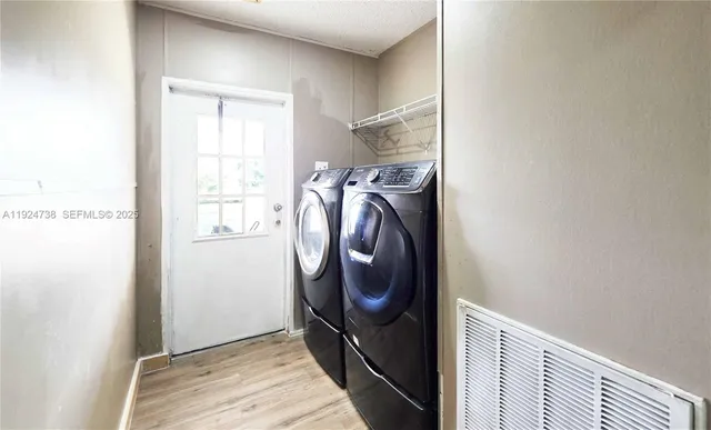 a utility room with dryer and washer