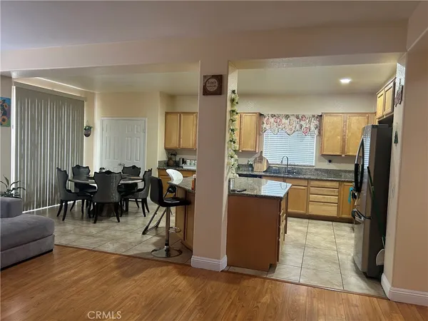 a kitchen with lots of counter top space and living room