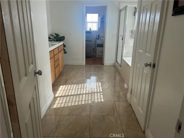 a bathroom with a glass door shower
