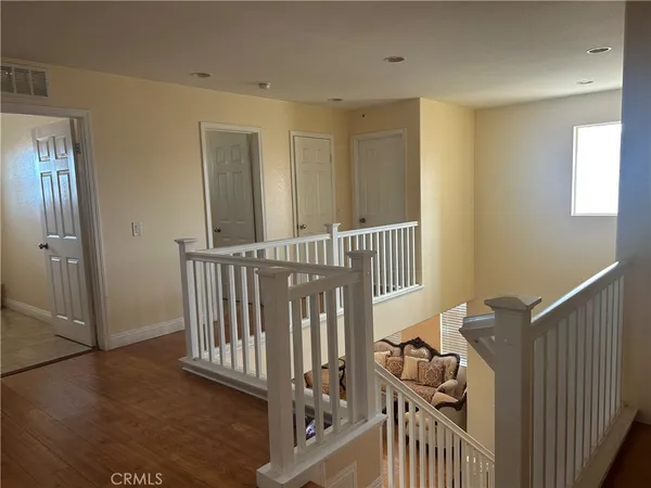 a view of a hallway with a bedroom