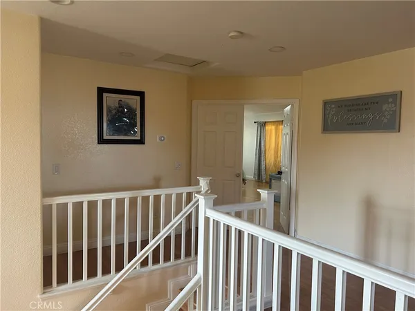 a view of a hallway with windows