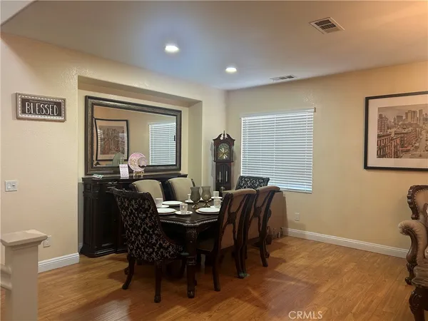 a dining room with furniture and window
