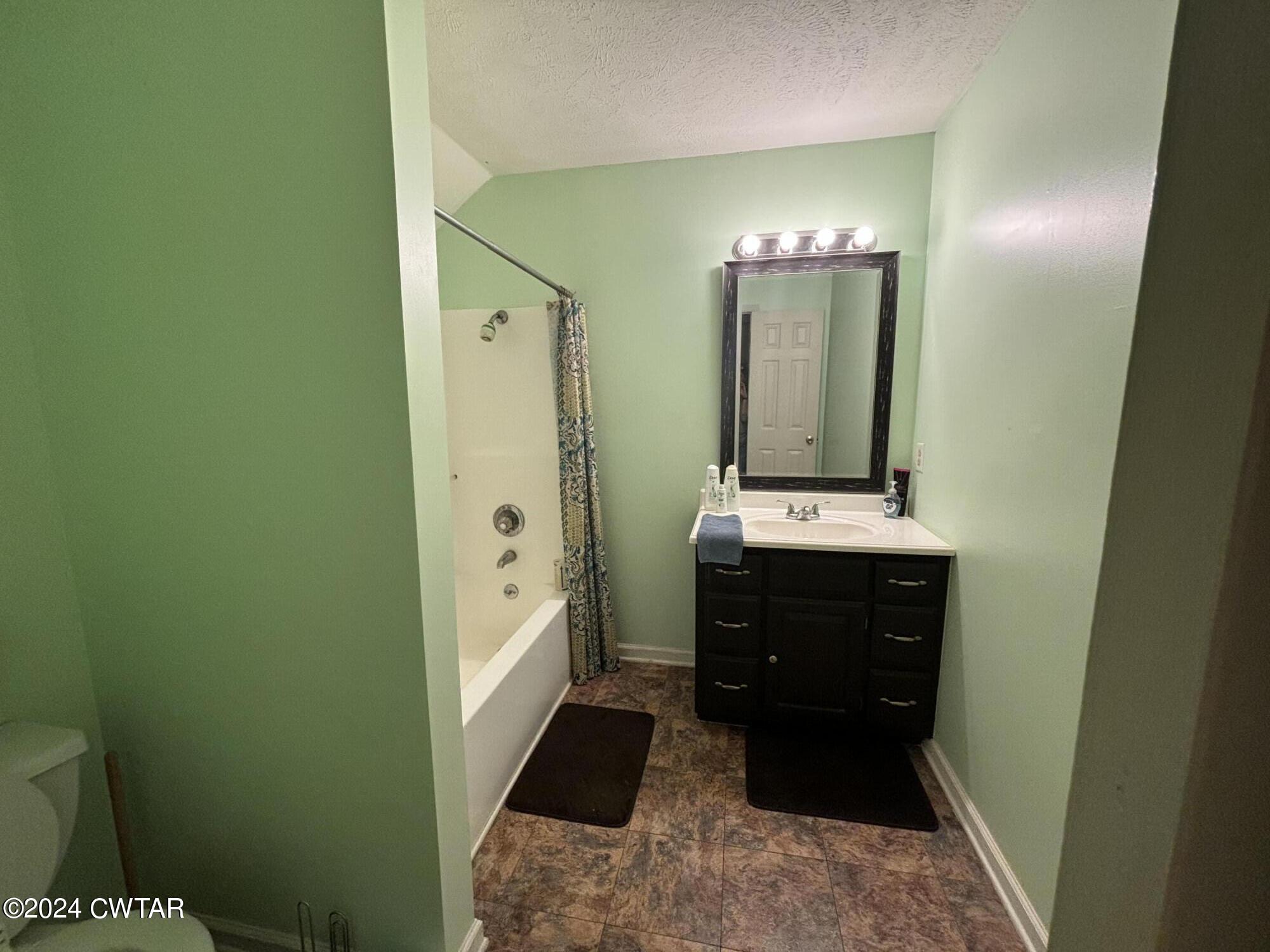 3100 Black Bottom Road Lexington, TN 38351 - Photo 14 of 16 a bathroom with a sink and a mirror