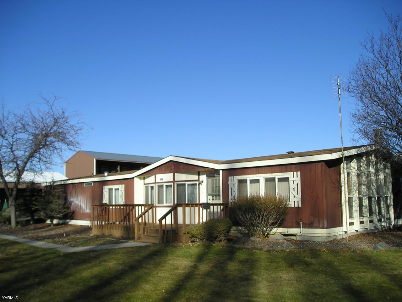 2681 Rosenkranz Road Tieton, WA 98947 - Photo 1 of 11 a front view of a house with a yard