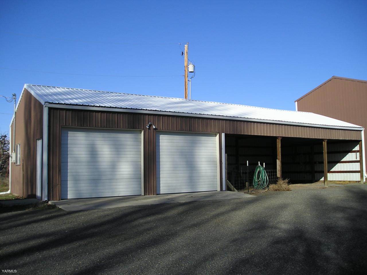 2681 Rosenkranz Road Tieton, WA 98947 - Photo 2 of 11 a view of outdoor space and front view of a house
