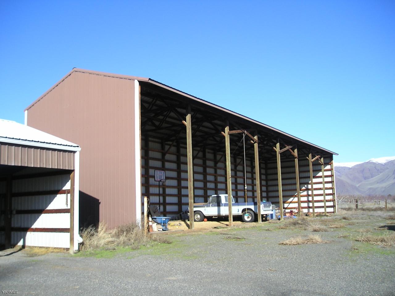 2681 Rosenkranz Road Tieton, WA 98947 - Photo 3 of 11 a front view of a house with a garage