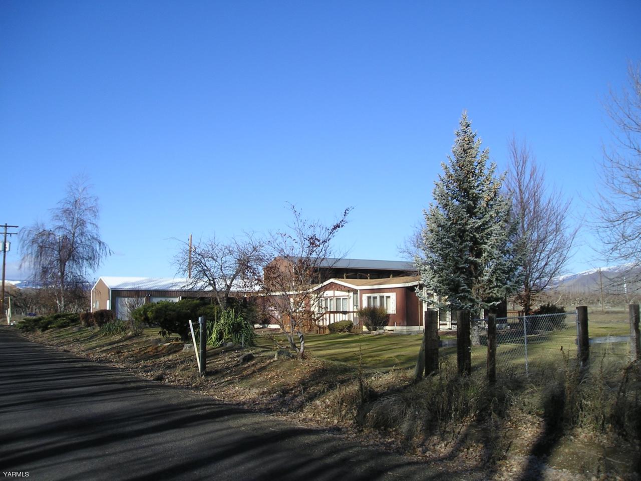 2681 Rosenkranz Road Tieton, WA 98947 - Photo 5 of 11 a view of a yard in front of the house with a yard