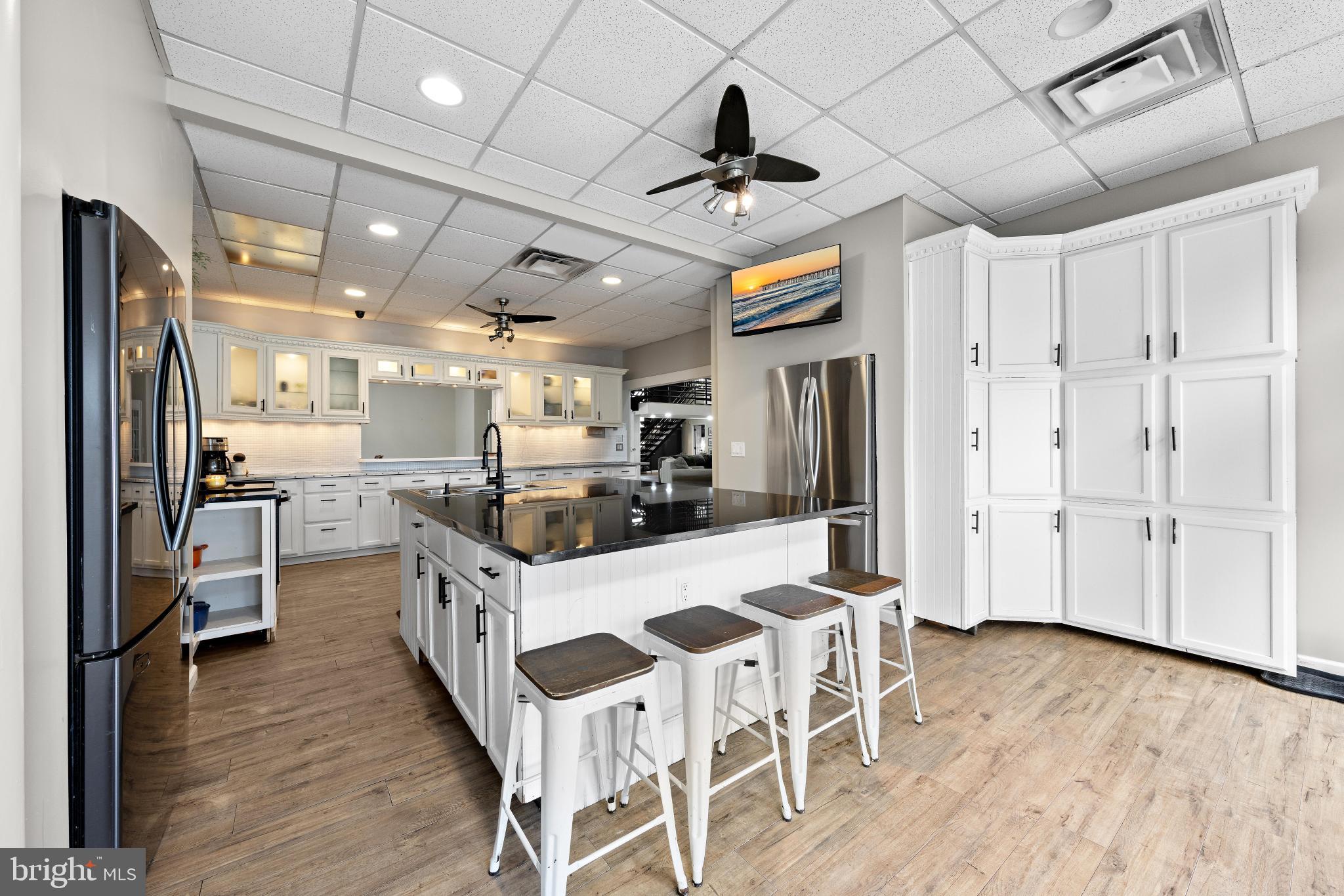 77 West Greenbush Road Tuckerton, NJ 08087 - Photo 21 of 75 a kitchen with stainless steel appliances kitchen island granite countertop a stove and a refrigerator