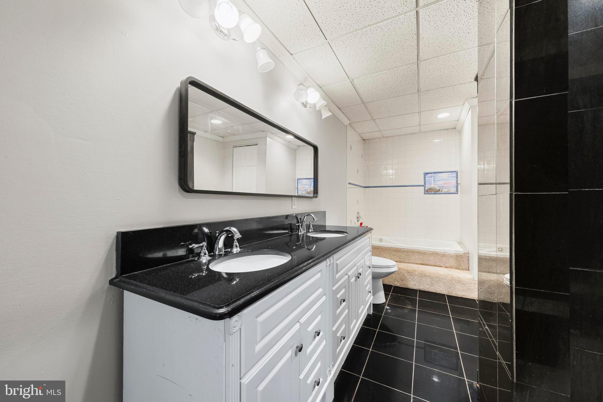 77 West Greenbush Road Tuckerton, NJ 08087 - Photo 34 of 75 a bathroom with a sink and a mirror