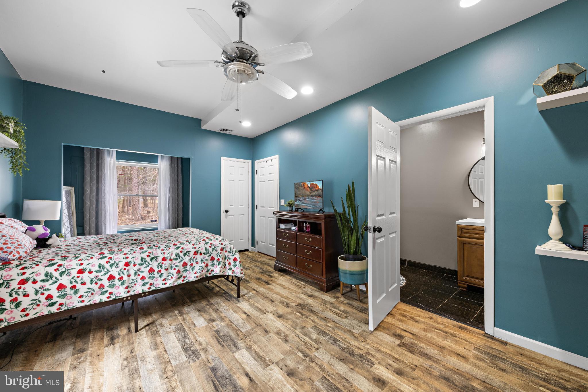 77 West Greenbush Road Tuckerton, NJ 08087 - Photo 37 of 75 a bedroom with a beds chandelier and a wooden floor