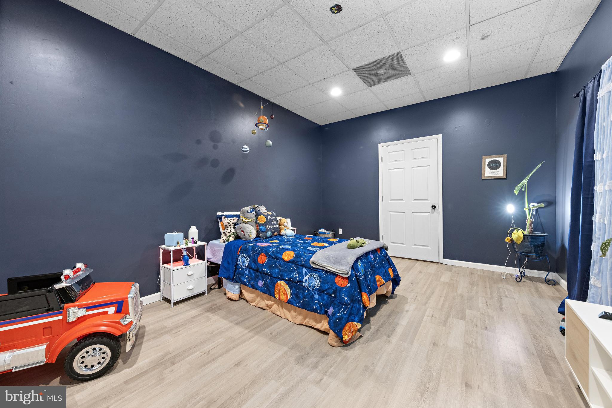 77 West Greenbush Road Tuckerton, NJ 08087 - Photo 38 of 75 a bedroom with a bed and a chandelier