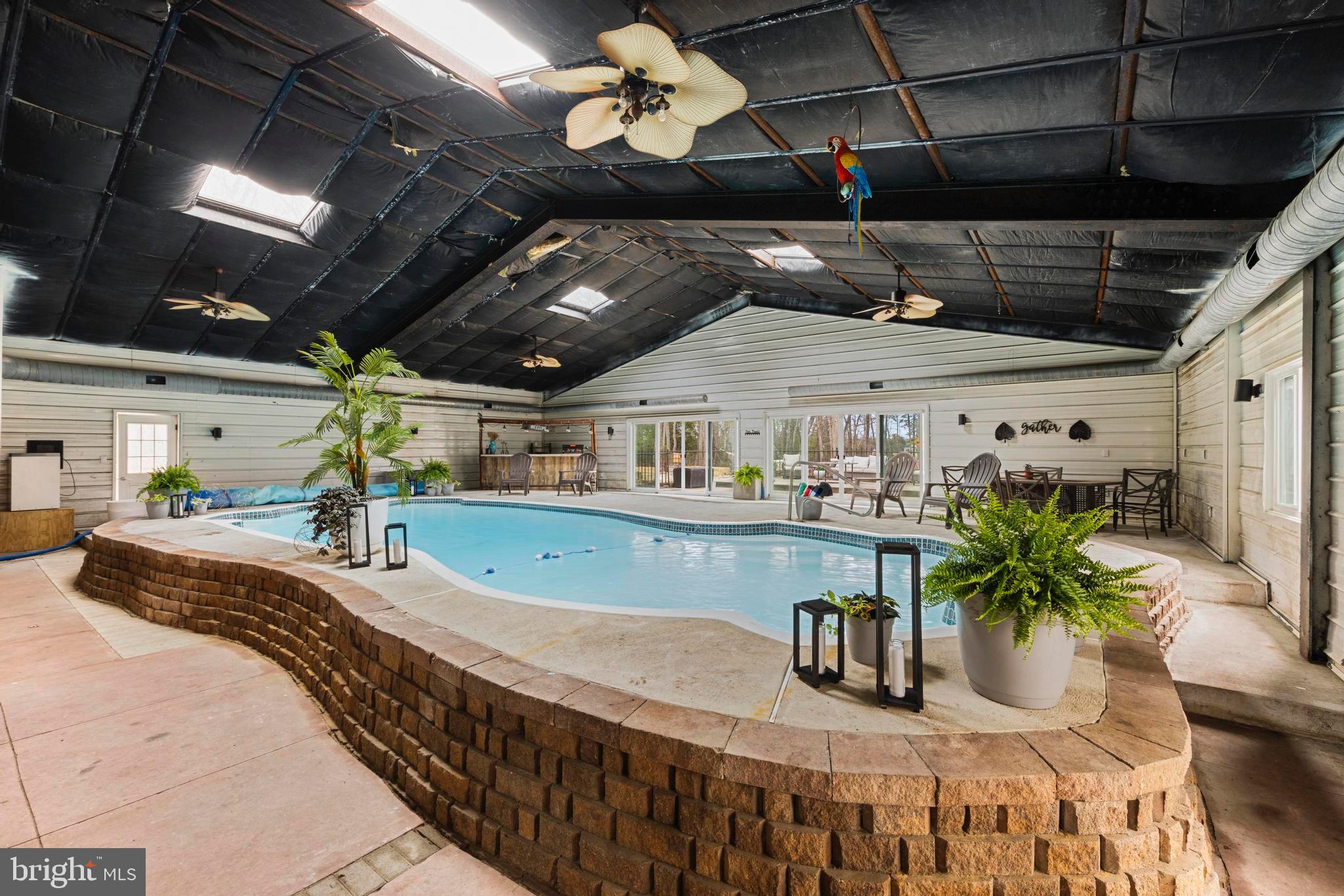 77 West Greenbush Road Tuckerton, NJ 08087 - Photo 54 of 75 a view of a swimming pool with a chairs