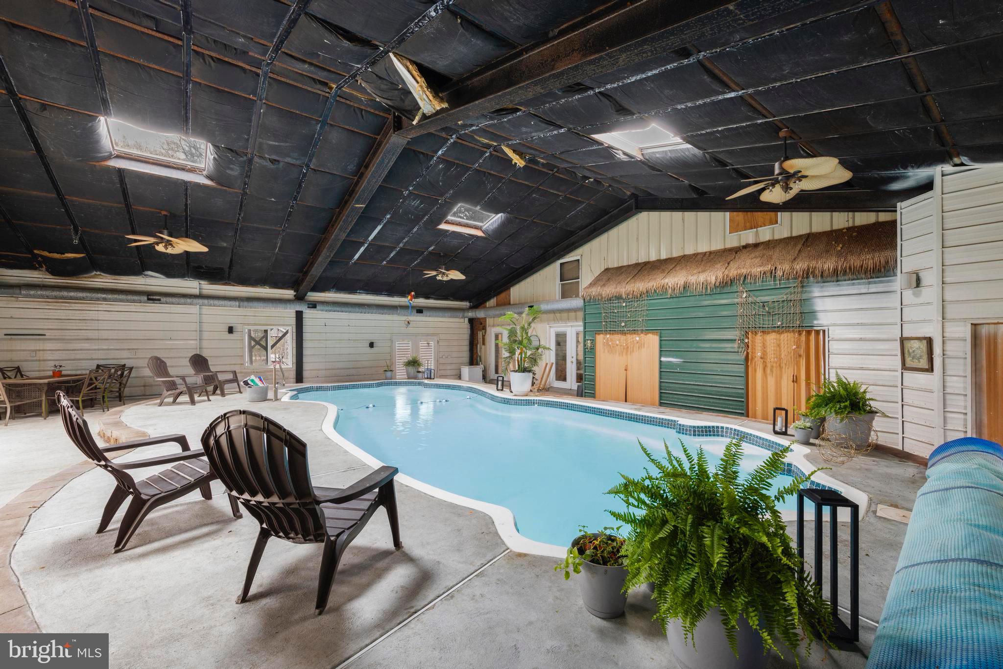 77 West Greenbush Road Tuckerton, NJ 08087 - Photo 56 of 75 a view of a patio with table and chairs with potted plants