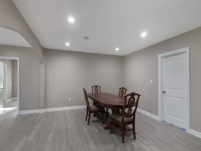 a view of a dining room with furniture and wooden floor