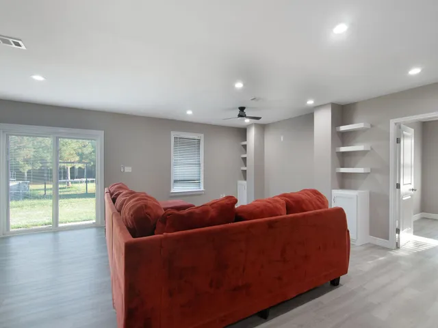 a living room with furniture and a window