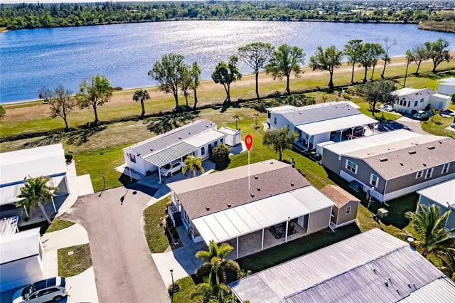 an aerial view of a house with a yard