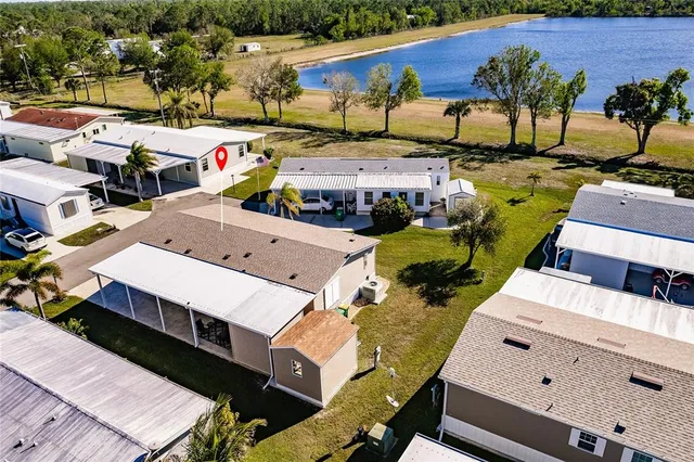 an aerial view of a house with garden space and street view
