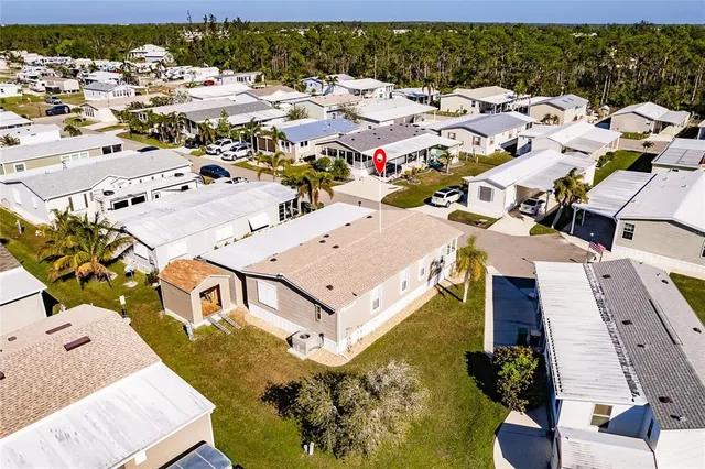 an aerial view of a house with a ocean view