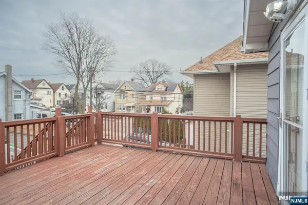 a view of a house with wooden deck