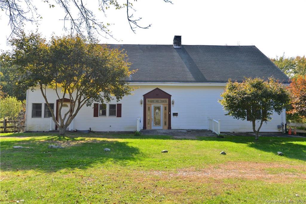 145 Boggs Hill Road Newtown, CT 06470 - Photo 1 of 1 a front view of a house with a yard
