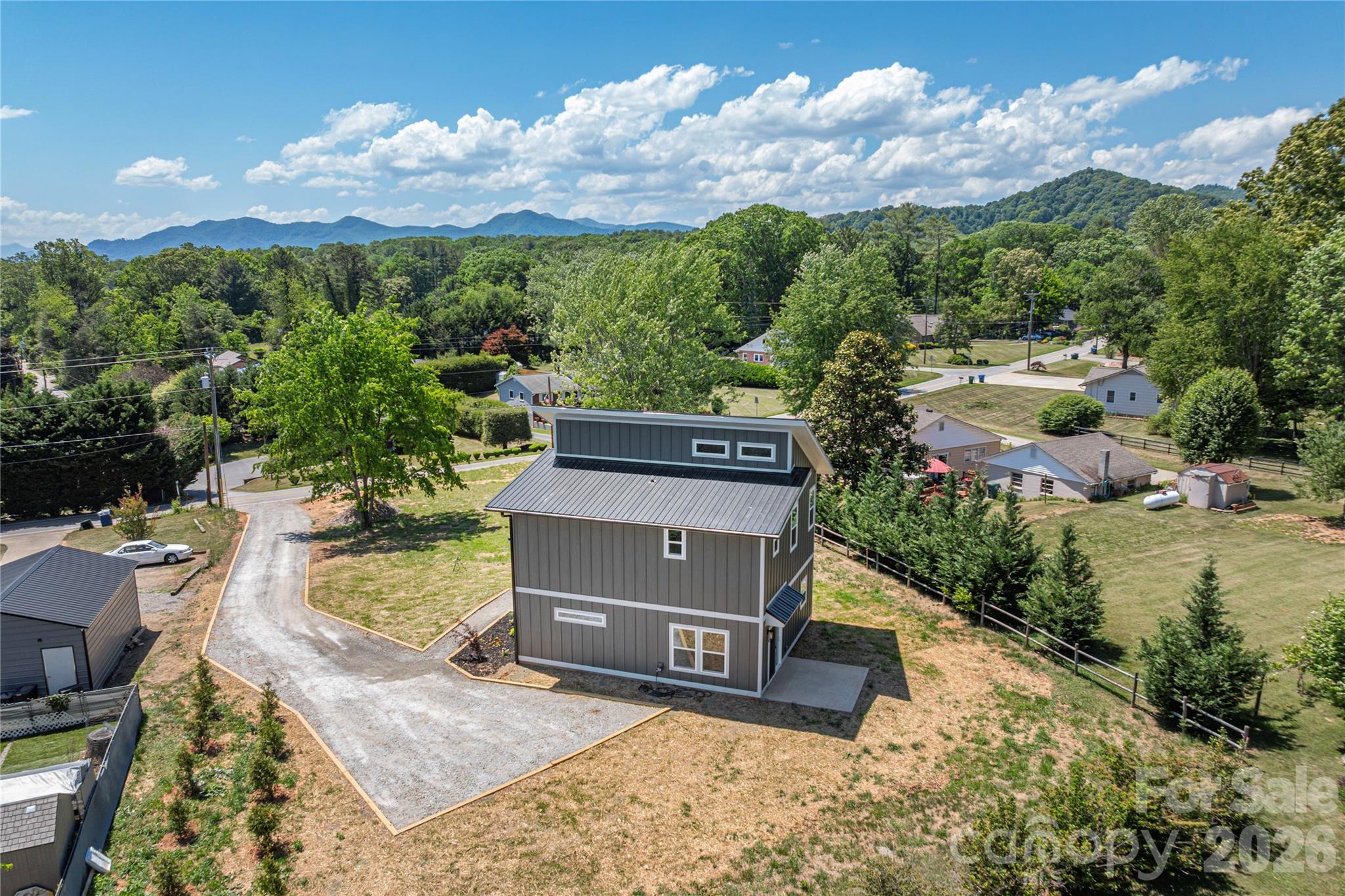 32 Oak Hill Road Candler, NC 28715 - Photo 27 of 29 an aerial view of a house with a garden