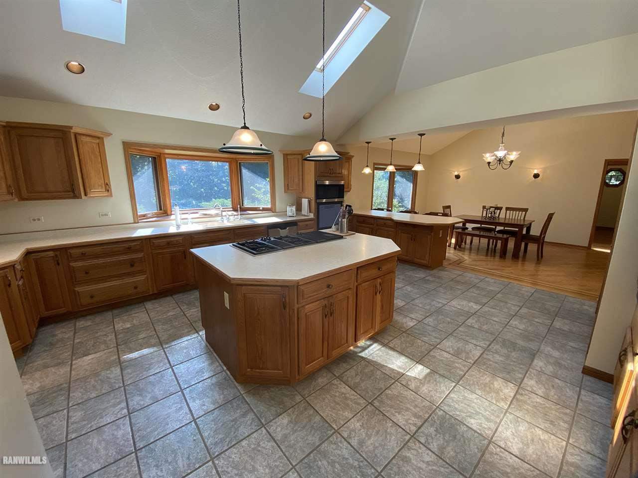32180 Chambers Grove Road Lanark, IL 61046 - Photo 17 of 44 a kitchen with a sink a counter top space and appliances