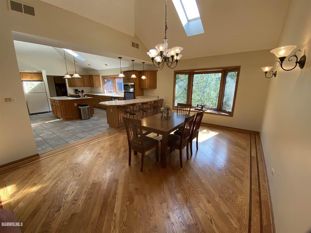 32180 Chambers Grove Road Lanark, IL 61046 - Photo 21 of 44 a view of a dining room with furniture and window