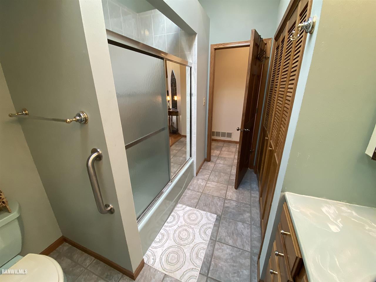 32180 Chambers Grove Road Lanark, IL 61046 - Photo 33 of 44 a bathroom with a shower and a toilet