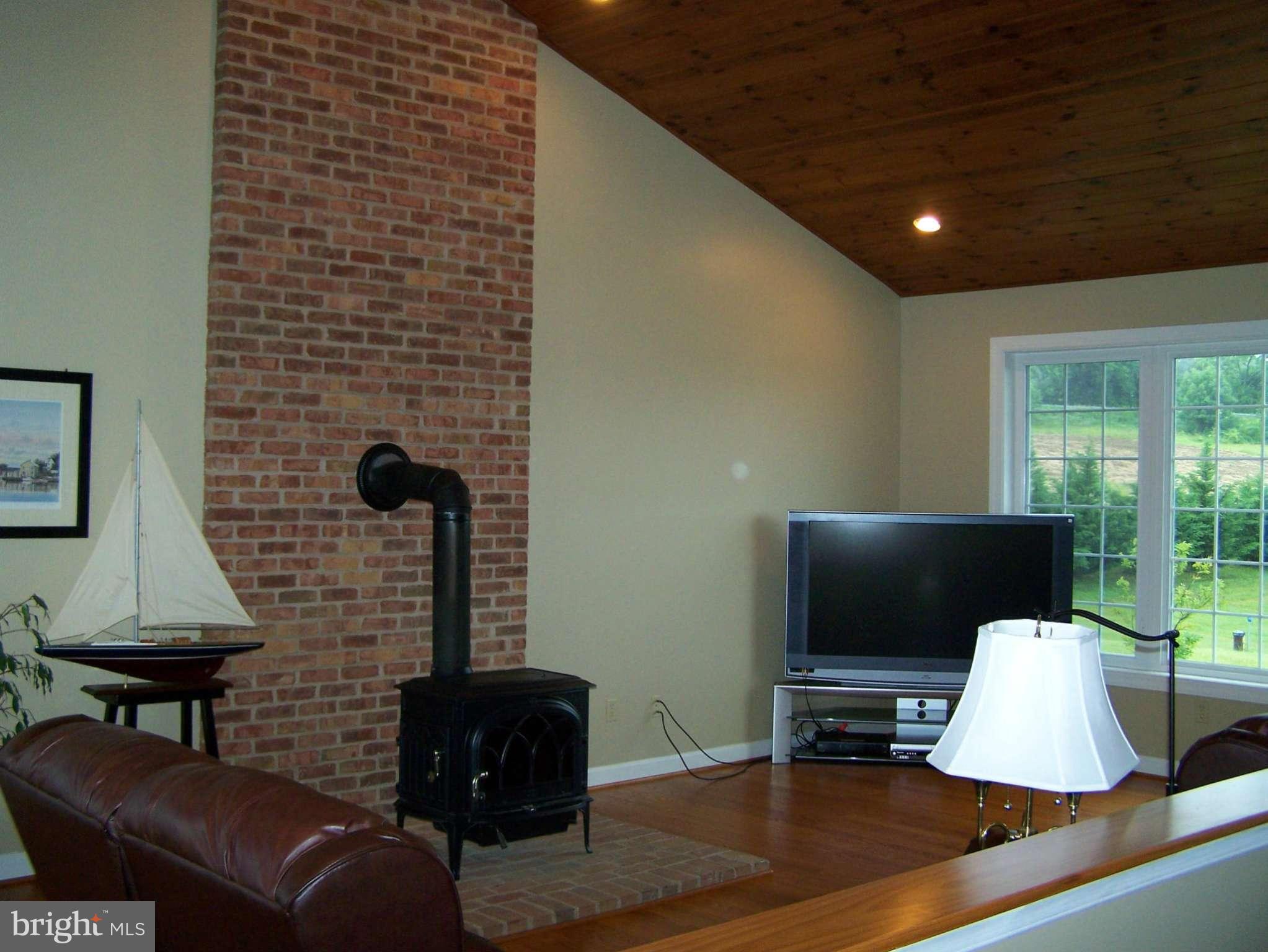 194 Clark Road Middletown, VA 22645 - Photo 22 of 30 a living room with furniture and a flat screen tv