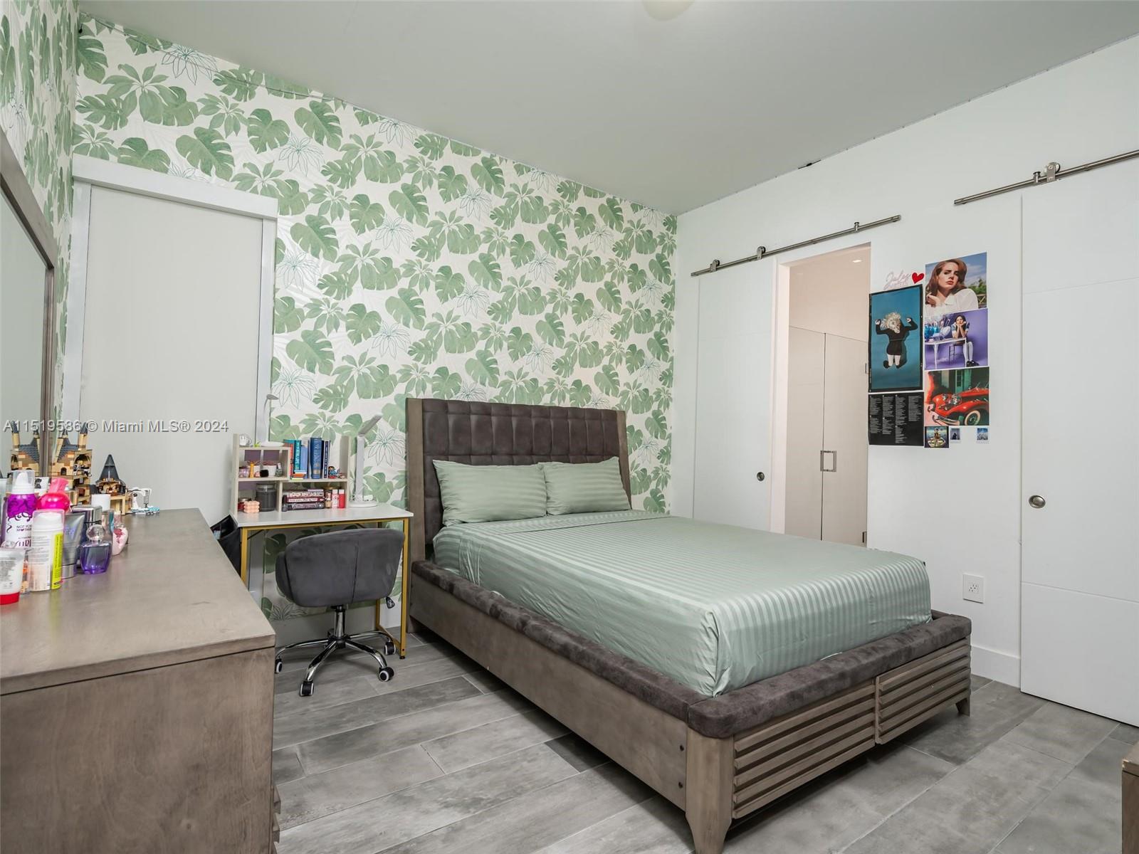 16601 Sunset Way Weston, FL 33326 - Photo 30 of 53 a bedroom with a bed and a table in it